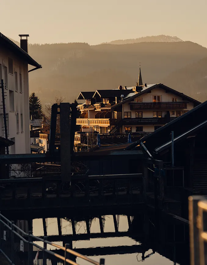 Mountain village at dusk with reflection